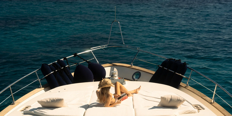 Astondoa_72_Lady_Elbaum_yacht_charter_mallorca_bow_sunbathing_girl