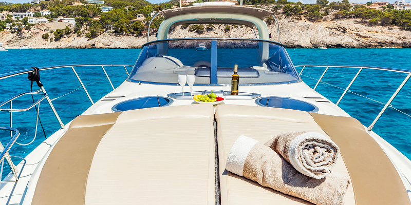 Bow sunbathing Gin Tonic Cranchi yacht charter Mallorca