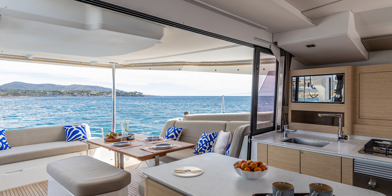 Catamaran Charter Mallorca Fountaine Pajot 44ft aft area with beautiful view of Mallorca