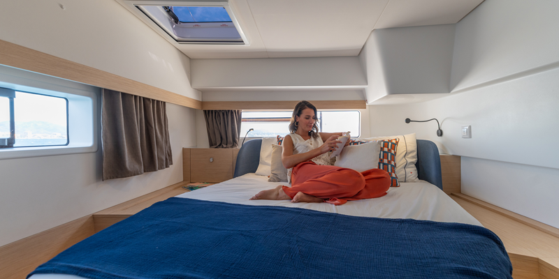 Catamaran Charter Mallorca Fountaine Pajot 44ft lady relaxing in cabin