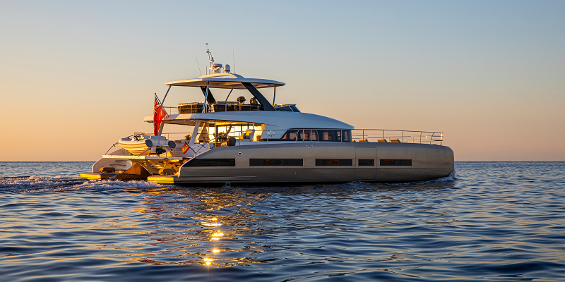 Power Catamaran Sasta Luxury Charter Mallorca exterior view underway at sunset