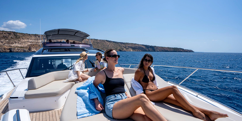 Princess_S66_The_Negotiator_Charter_Yacht_Mallorca_exterior_bow_sunbathing_girls