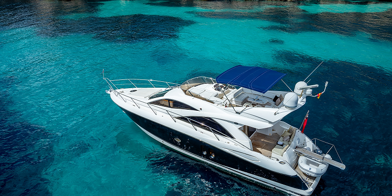 Pure Indulgence yacht charter mallorca Sunseeker Manhattan 50 in a beautiful turquoise bay