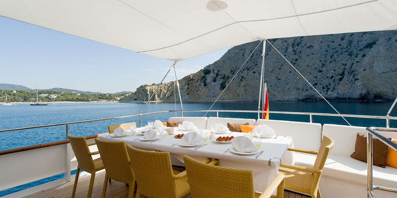 Dining table on yacht semaya available for charter in Mallorca with Lamprell Marine